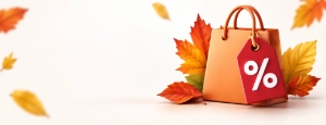 Einkaufstasche mit rotem Prozentanhänger, umgeben von bunten Herbstblättern.Saisonale Aktionen schaffen aktuelle Kaufanlässe am Point of Sale.
